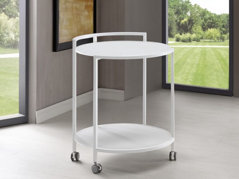 A white, round, two-tier serving cart with wheels is positioned near large windows in a modern room with light flooring.