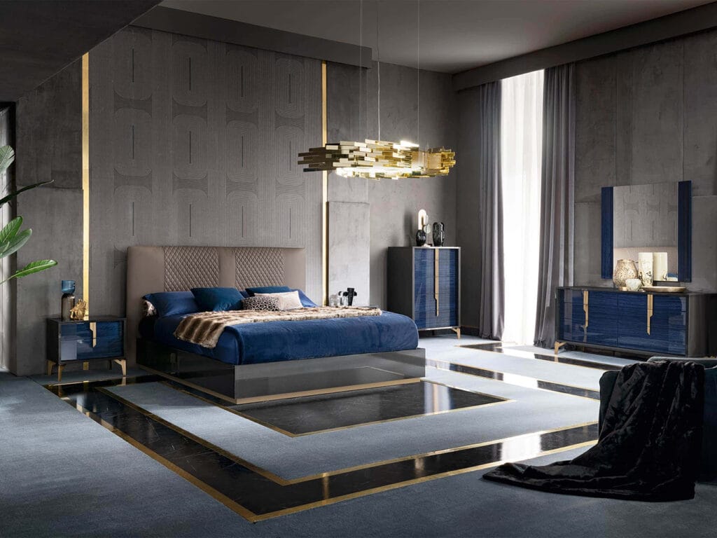 Luxurious modern bedroom with a blue and gold color scheme, geometric patterns, a large bed, pendant light, and contemporary furniture. Floor and wall feature gold accents.